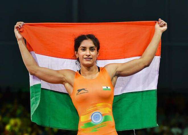 Vinesh Phogat celebrates after winning the gold medal at the Gold Coast 2018 Commonwealth Games